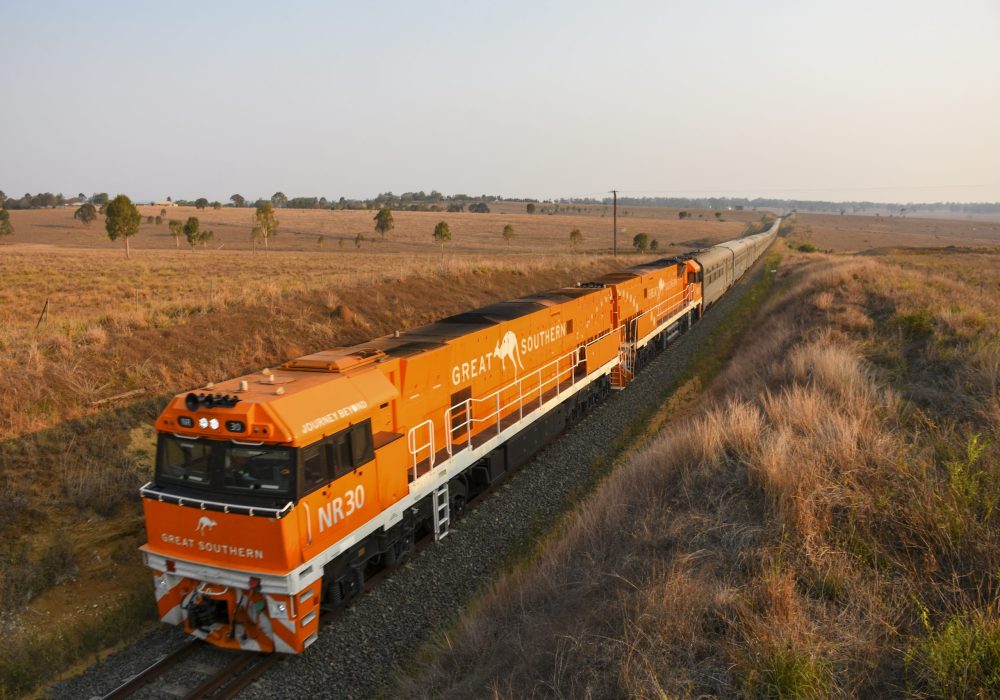 The Great Southern train winding through golden Australian countryside